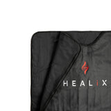 Close-up of the HEALiX-Z Sauna Blanket’s edge, highlighting the stitching details and fabric quality