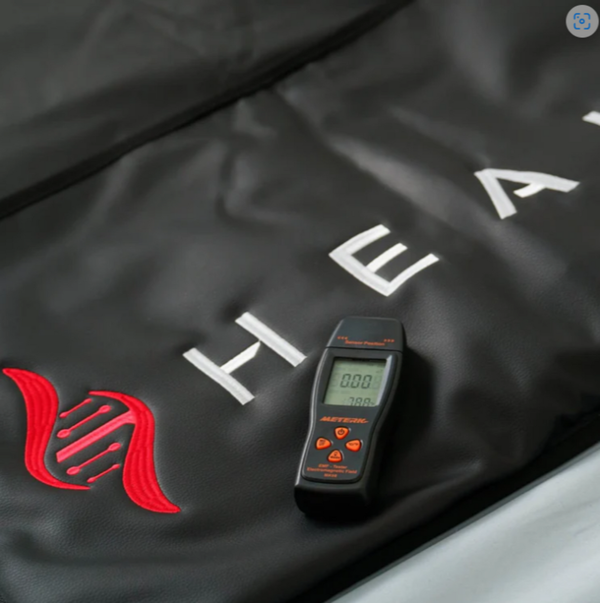 Close-Up of Controls: Close-up of the digital control panel on the HEALiX Sauna Blanket, highlighting temperature and timer settings