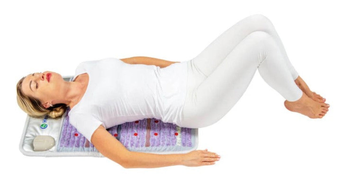 HealthyLine Platinum Mat™ in use on a bed, providing therapeutic support to the upper body