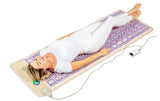 A person lying on the TAJ-Mat™ in a serene environment, highlighting relaxation and therapy benefits.