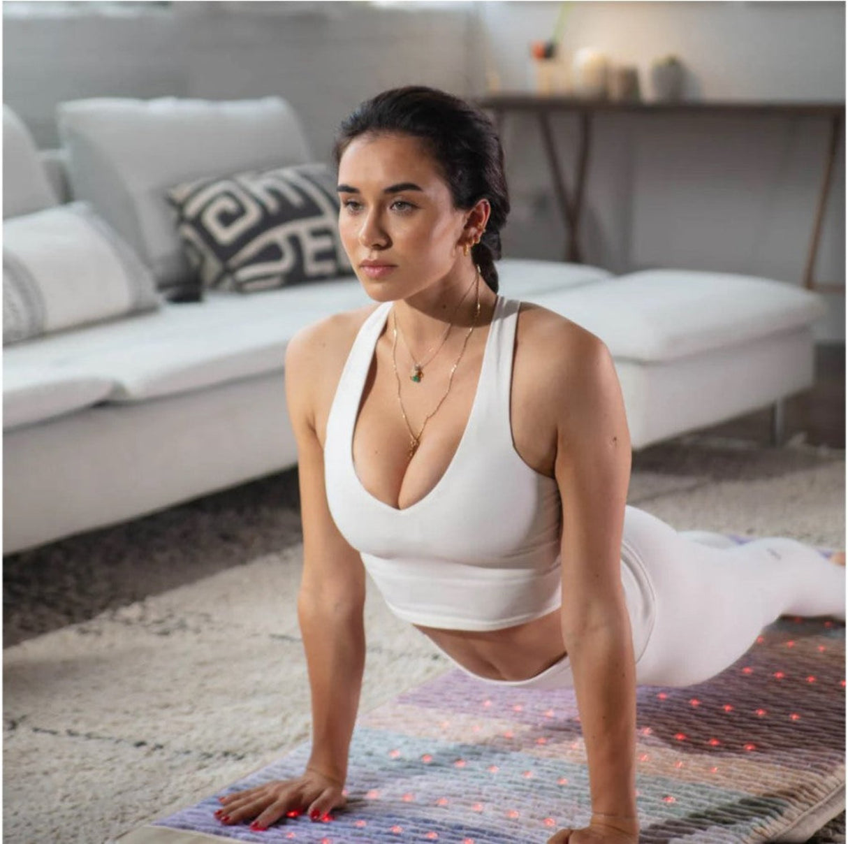 A person performing a yoga pose on the mat, illustrating its suitability for various wellness activities.