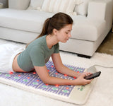 : The model is in a relaxed position, showcasing the mat's comfort and support.