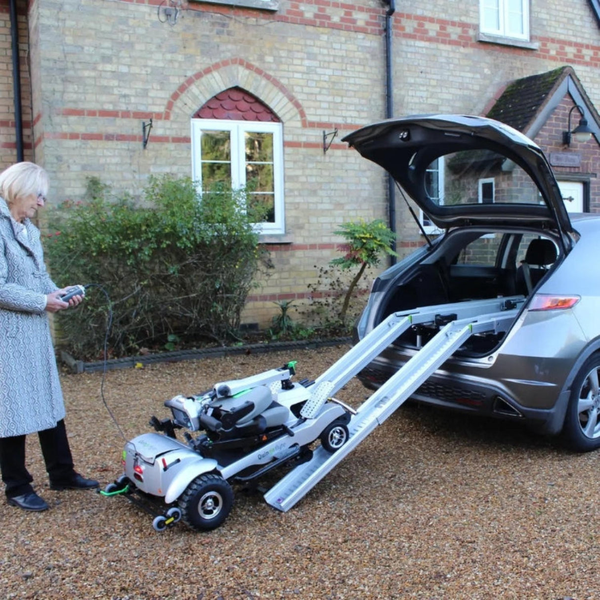 Quingo Flyte Mobility Scooter With MK2 Self Loading Ramp Storage View